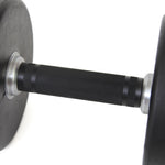 Close-up of a commercial dumbbell from the SMAI Commercial Dumbbell Set with Rack 5-60kg, featuring a black, textured grip and round rubber-coated weights on each end, set against a white background.