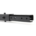 Close-up view of the "X-Frame - Upright Extension - 3ft" by No Sync To Channel Engine, featuring a black metal rectangular tube with holes and a sliding mechanism. This product suggests it could be part of a versatile modular system, ideal for use in rigs and rack kits.