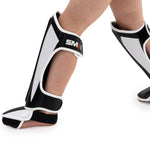 Essentials Muay Thai Shin Guards - Kids (pair) on foot