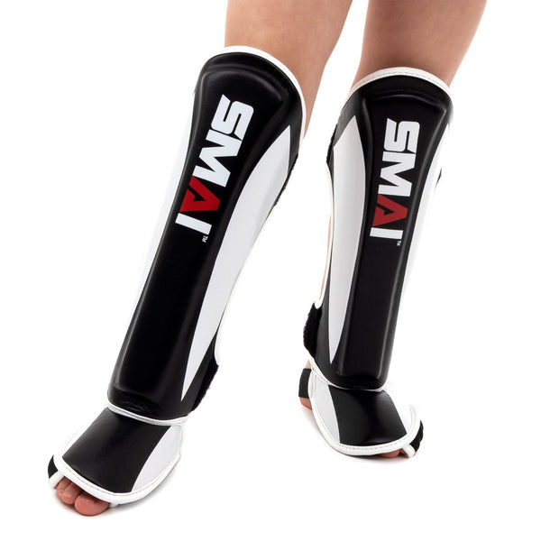 Essentials Muay Thai Shin Guards - Kids (pair) on foot