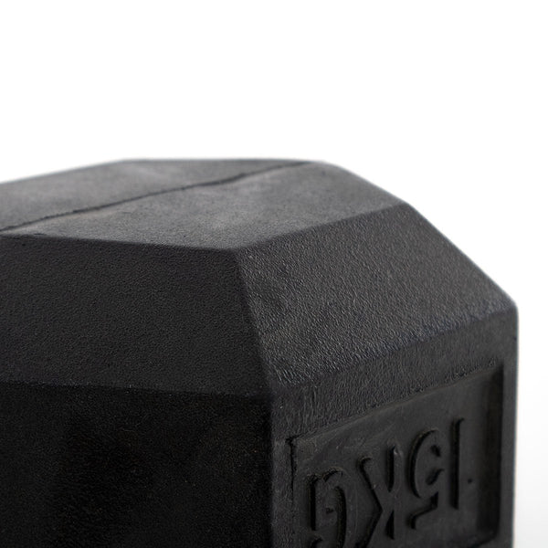 Close-up of a Rubber Hex Dumbbell from the SMAI Rubber Hex Dumbbells Classic - Set 42.5kg-50kg Pairs, showcasing a chrome grip with emphasis on the angled corner and embossed weight label against a white background.