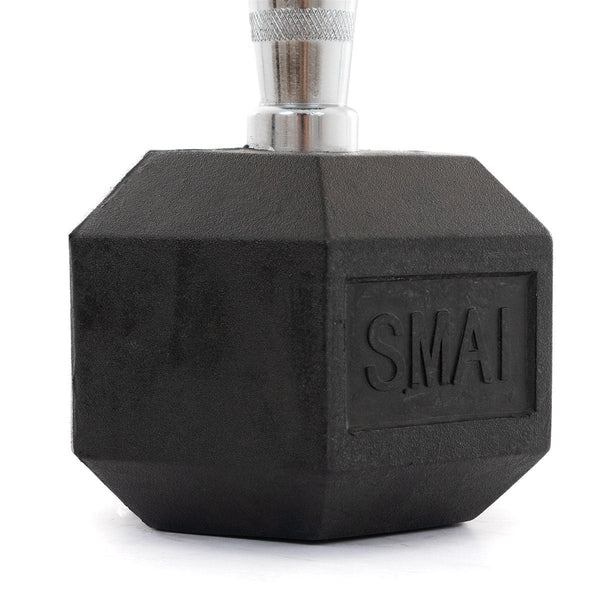 A close-up of a heavy-duty black rubber hex dumbbell from the Rubber Hex Dumbbells Classic set by SMAI, with "SMAI" embossed on its surface. The metallic chrome grip handle features a textured design and is positioned upright against a plain white background, exemplifying both functionality and style.