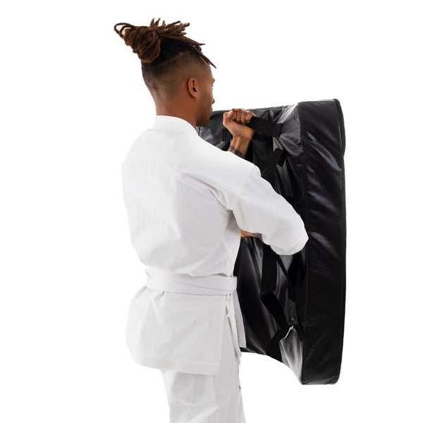 Shield - Kyokushin Body Being held by a man back view