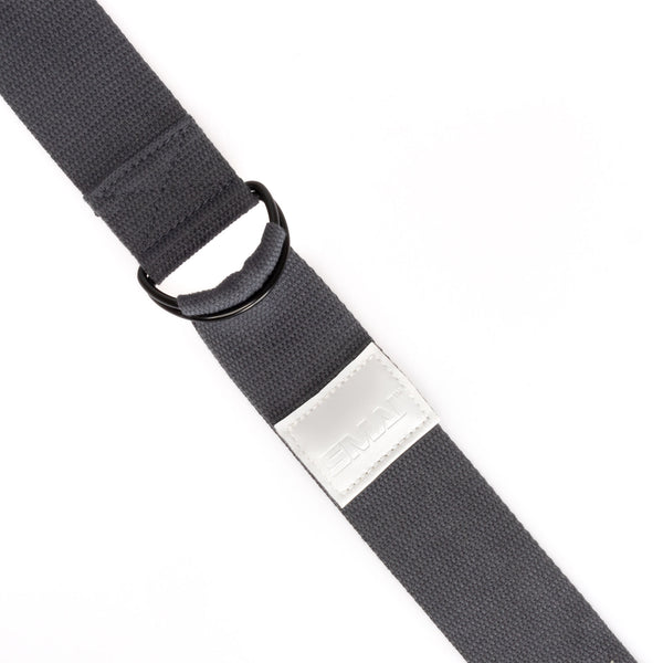 Close-up of the Yoga Strap Grey by Sale Item, showcasing its adjustable length with a metal ring and a silver rectangular label, all on a white background.